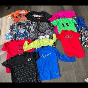 8-10 yr old M-L Nike and Under Armour Shirts.